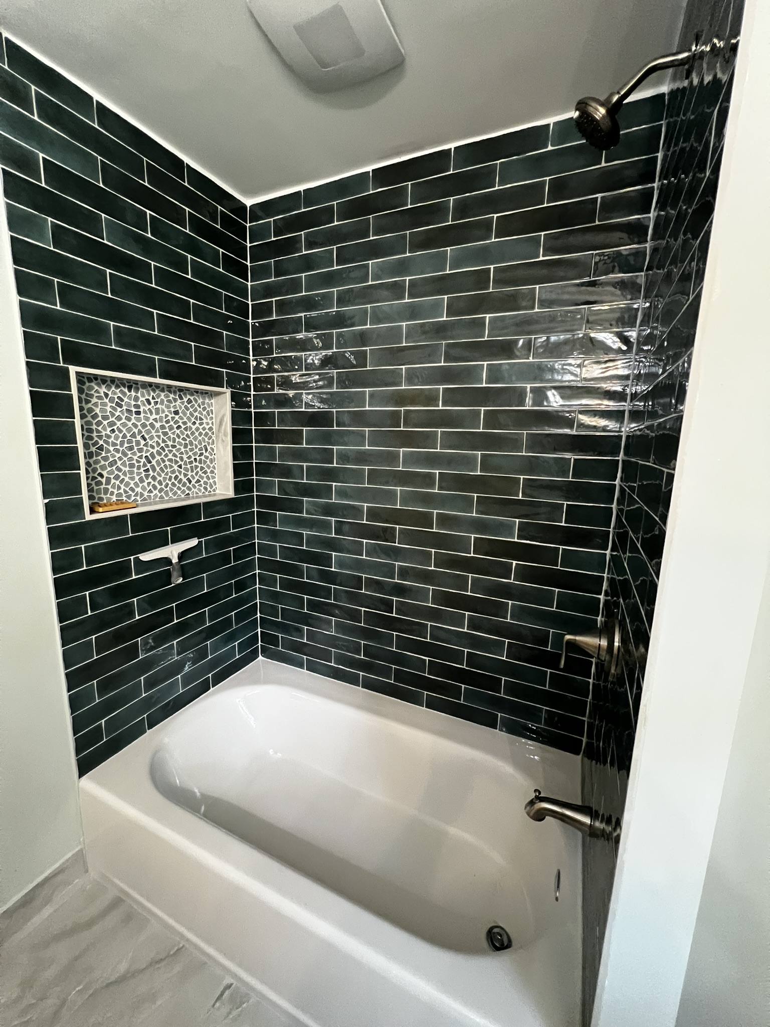 Bathroom tile and flooring work completed by KesRemodel for a real bathroom remodel