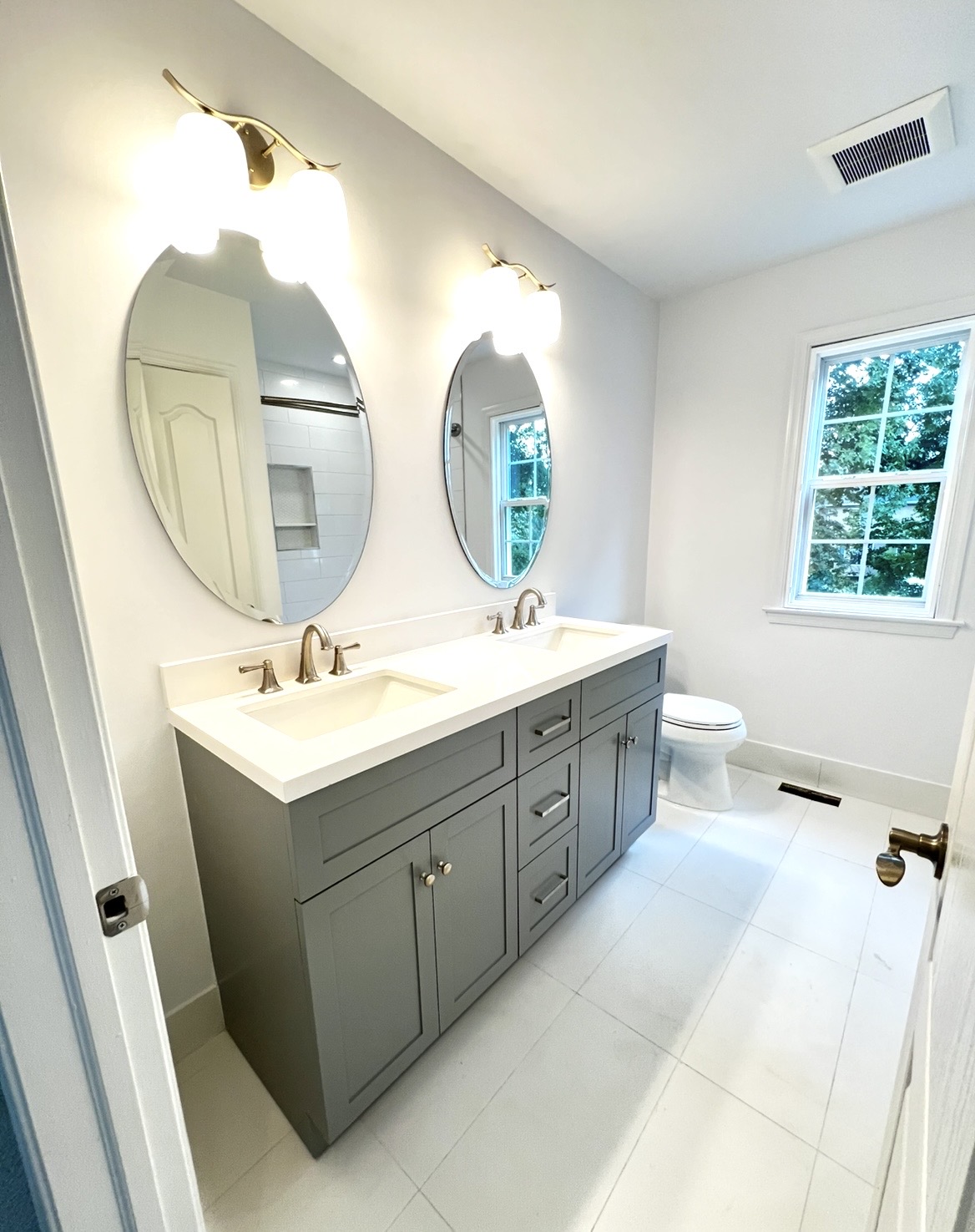 Finished bathroom remodel completed by KesRemodel showing the completed layout vanity and final details