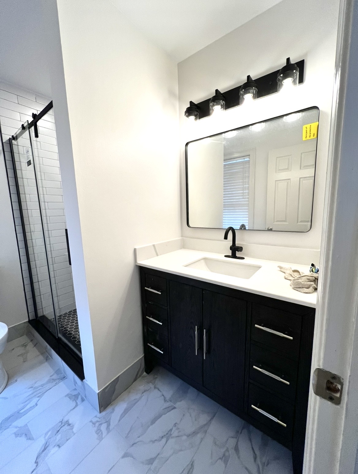Bathroom remodel near completion by KesRemodel showing updated materials and layout changes