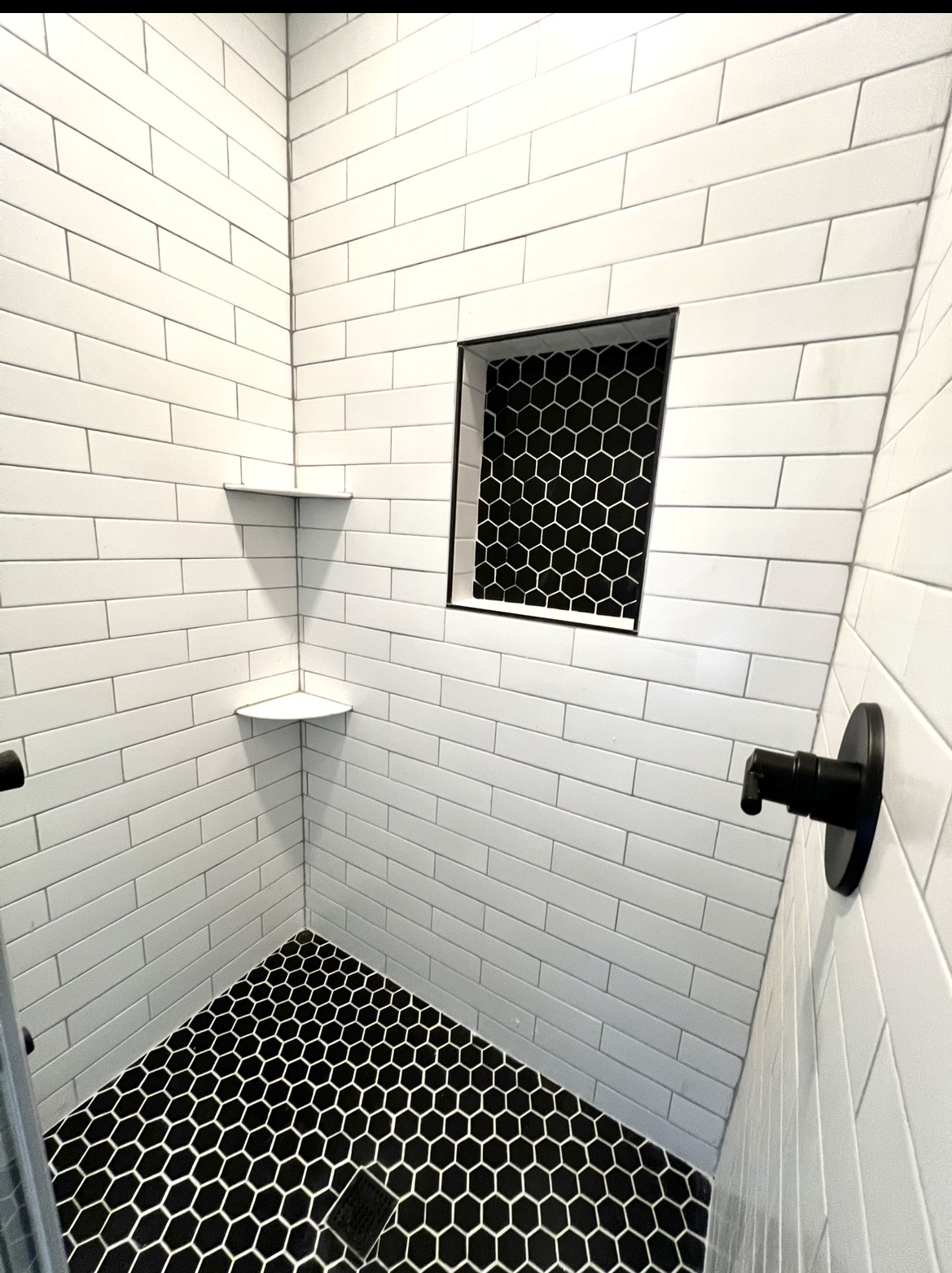 Bathroom renovation transition photo from KesRemodel showing progress during the build