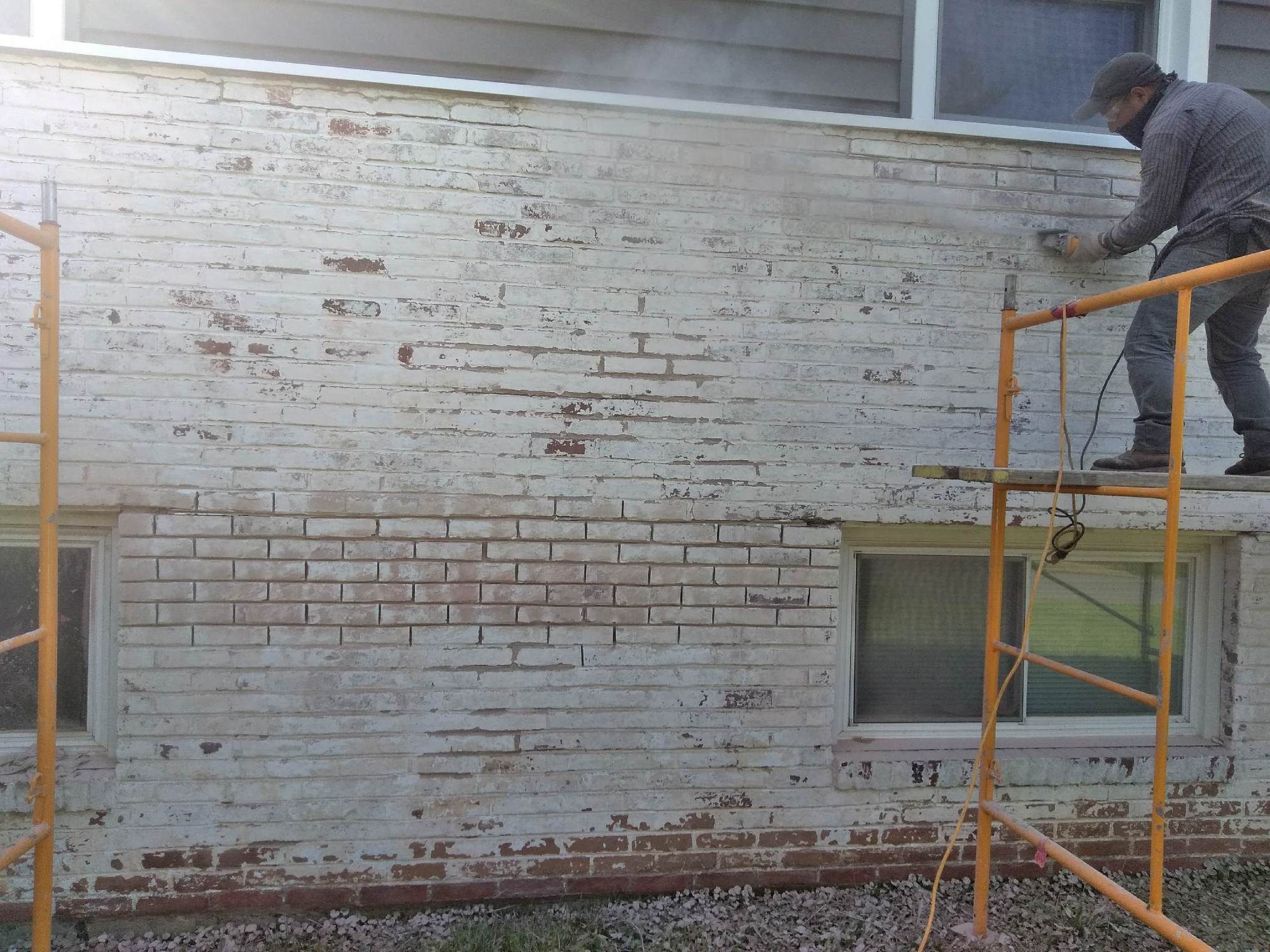 Brick wall restoration and masonry repair work by KesRemodel on a real client project