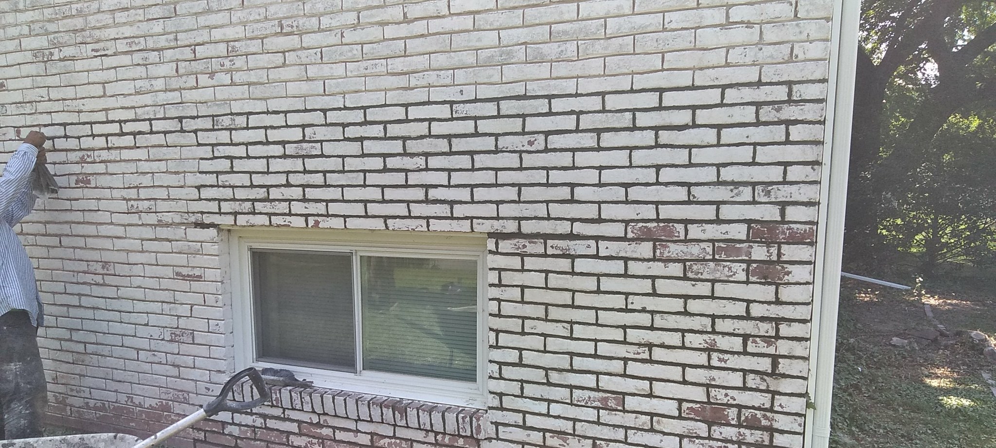 Exterior brick wall masonry work by KesRemodel