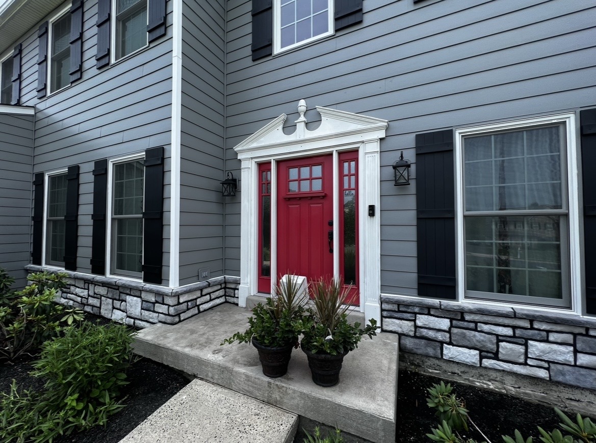 Front entry stone veneer masonry detail completed by KesRemodel