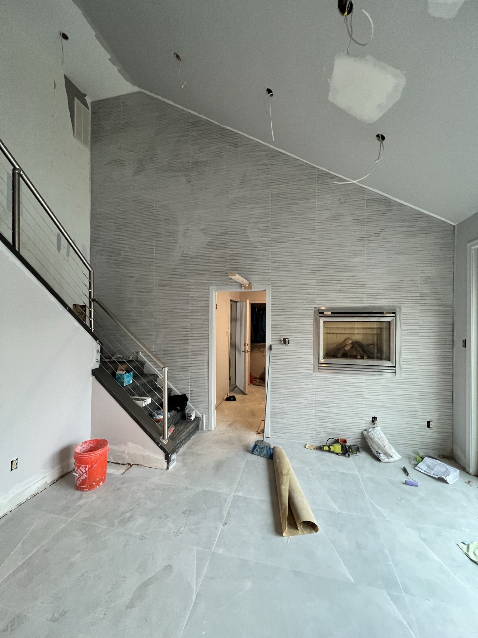 Finished interior stone feature wall and fireplace masonry project completed by KesRemodel