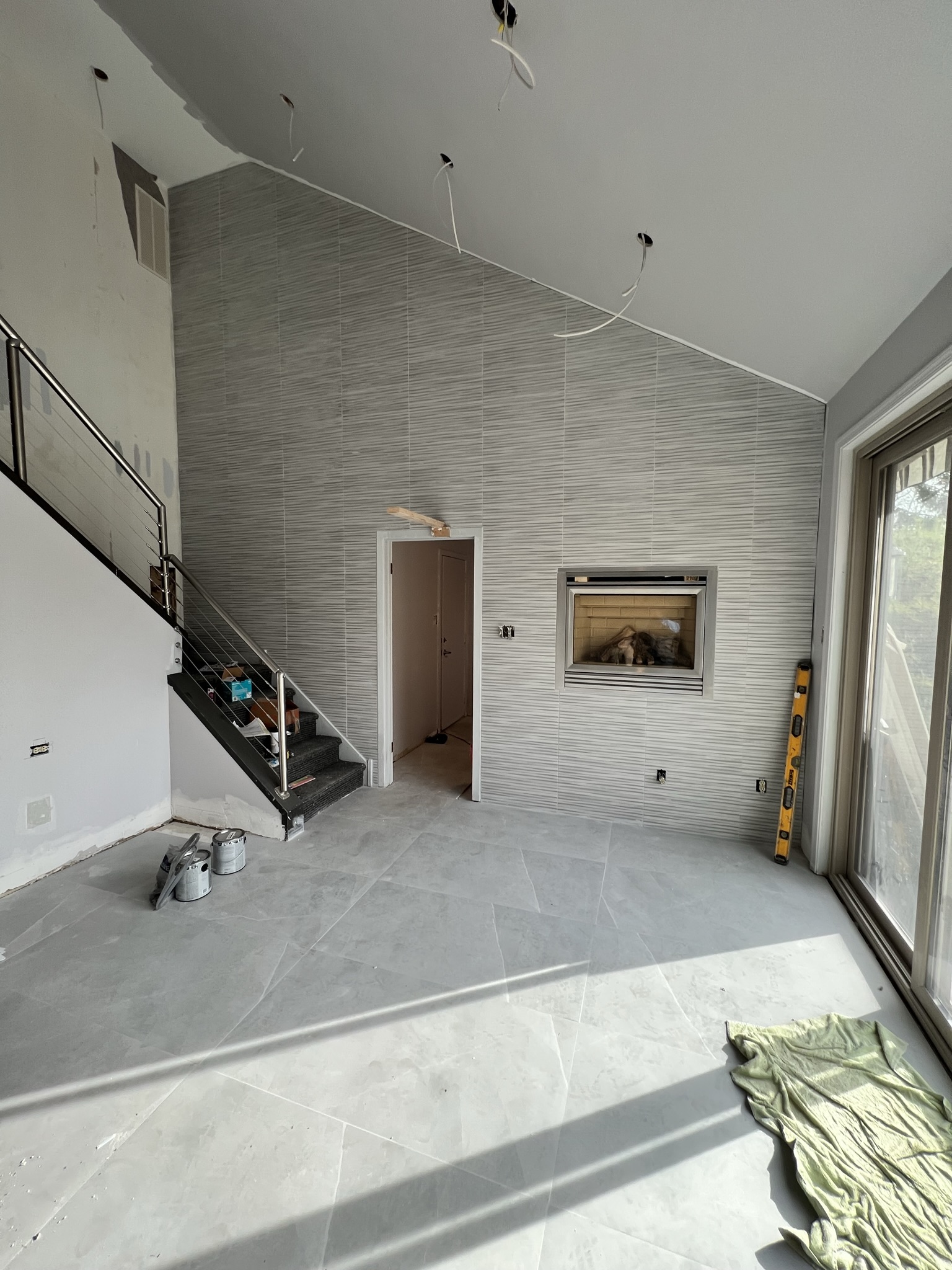 Wide view of finished interior stone wall project by KesRemodel
