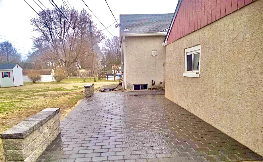 Paver patio and retaining wall masonry work completed by KesRemodel