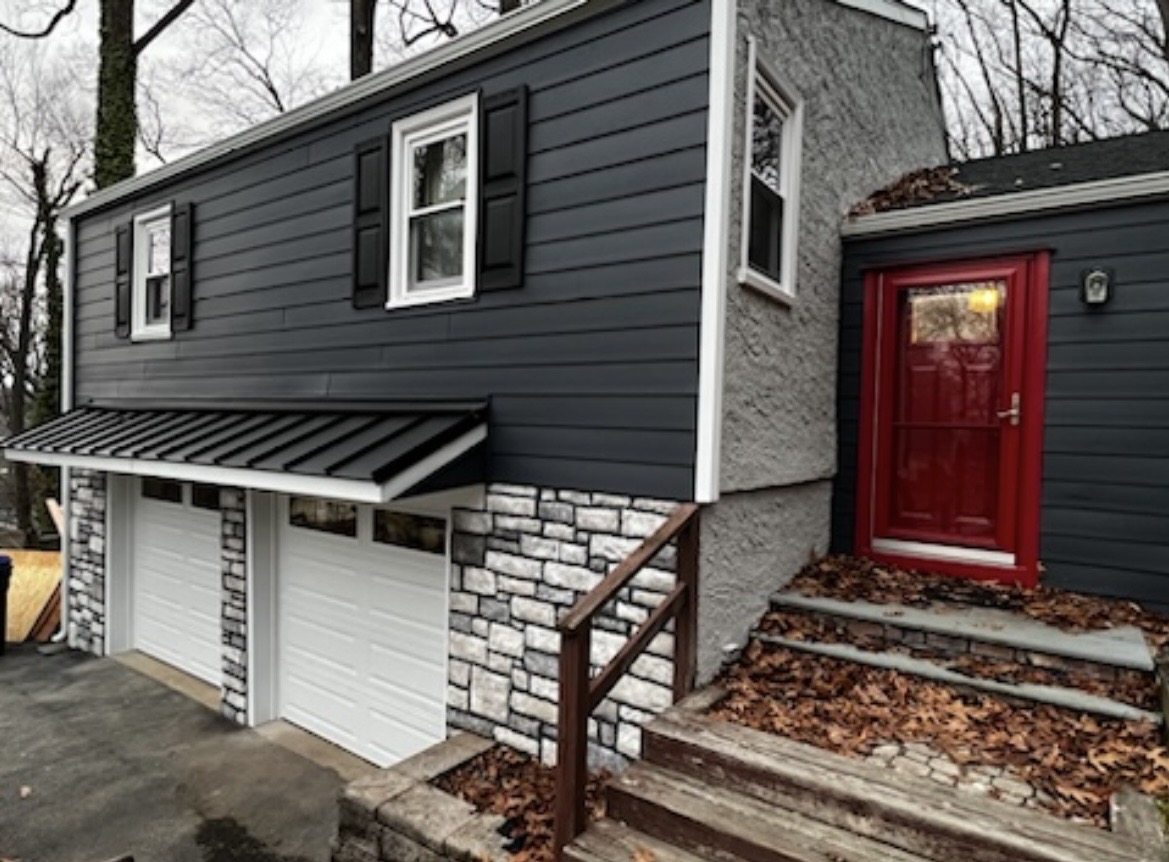 Stone veneer garage and exterior steps masonry work completed by KesRemodel